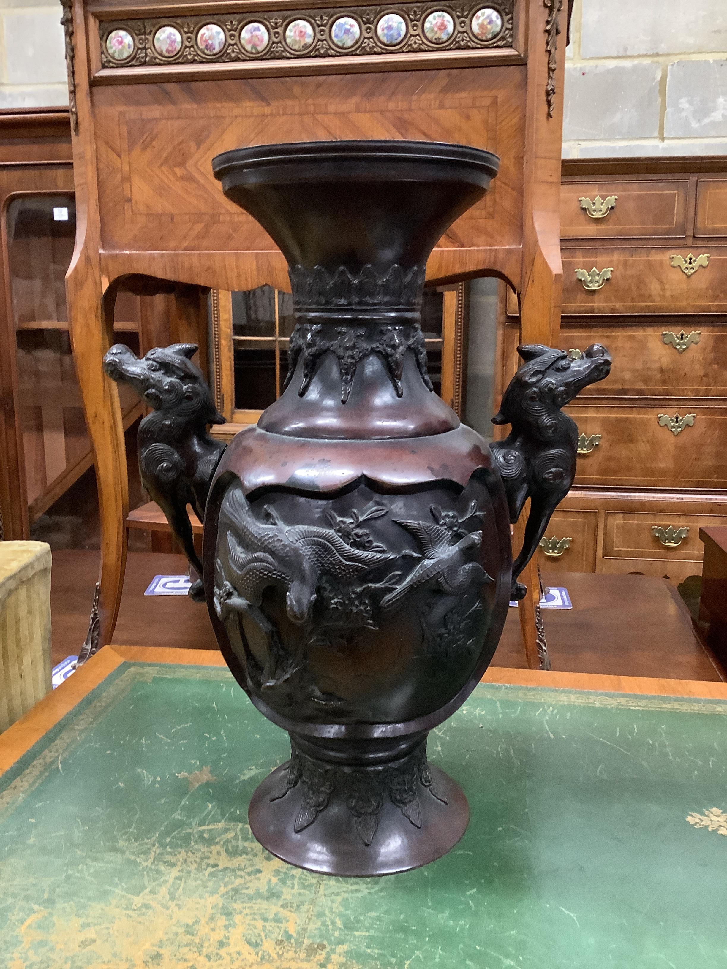 A Chinese circular marble topped vase stand, height 56cm together with a Japanese bronze two handled vase